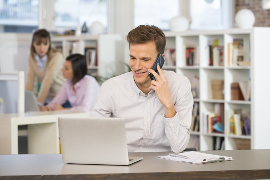 Man Cheerful desk cell phone young