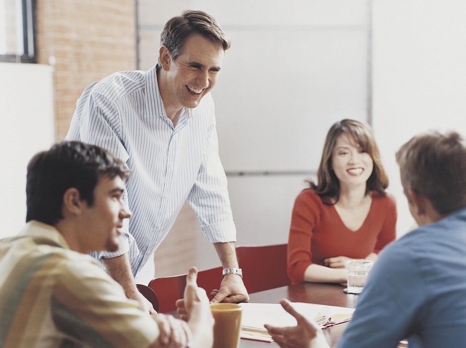 manager-laughing-at-a-conference-room-meeting-during-a-discussion-dv1244037-57ab3e9d3df78cf459924039