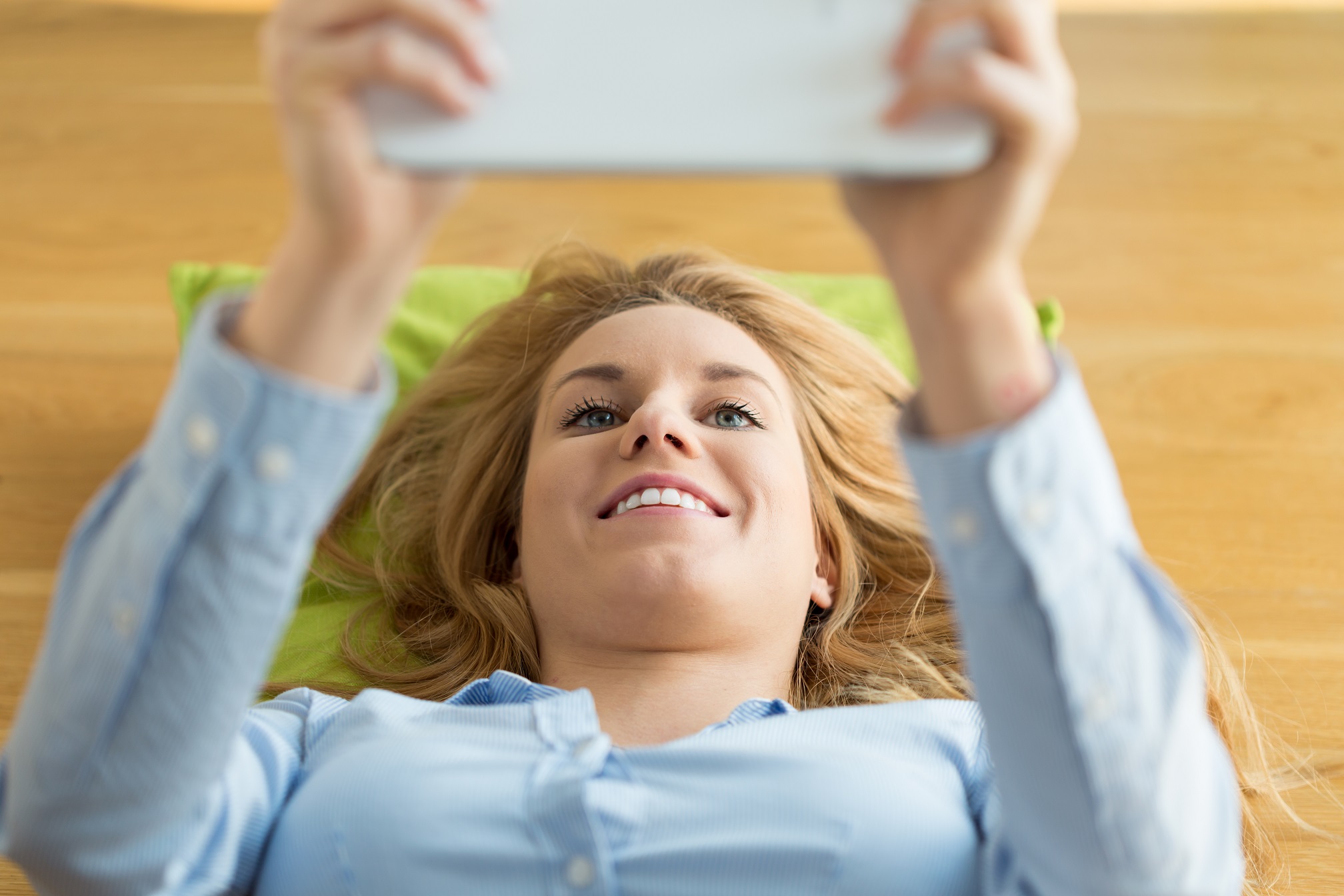 Woman using tablet in the morning, horizontal